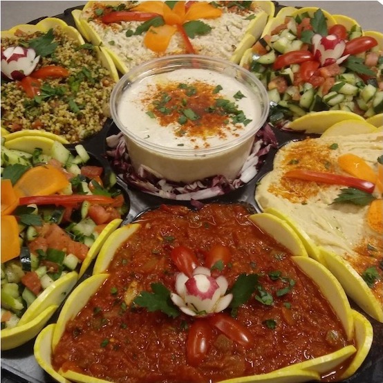 Kosher appetizer platter with hummus and salads by Jerusalem Catering NJ